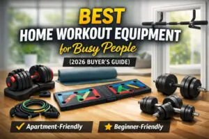 Best home workout equipment for busy people including resistance bands, adjustable dumbbells, push-up board, and pull-up bar in a small apartment setup